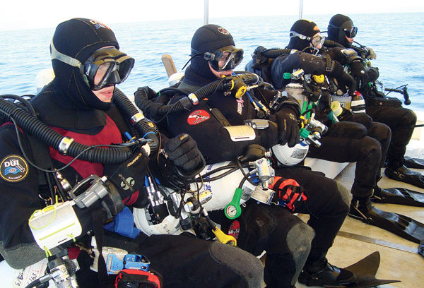 The mixed-gas divers worked as two four-man teams