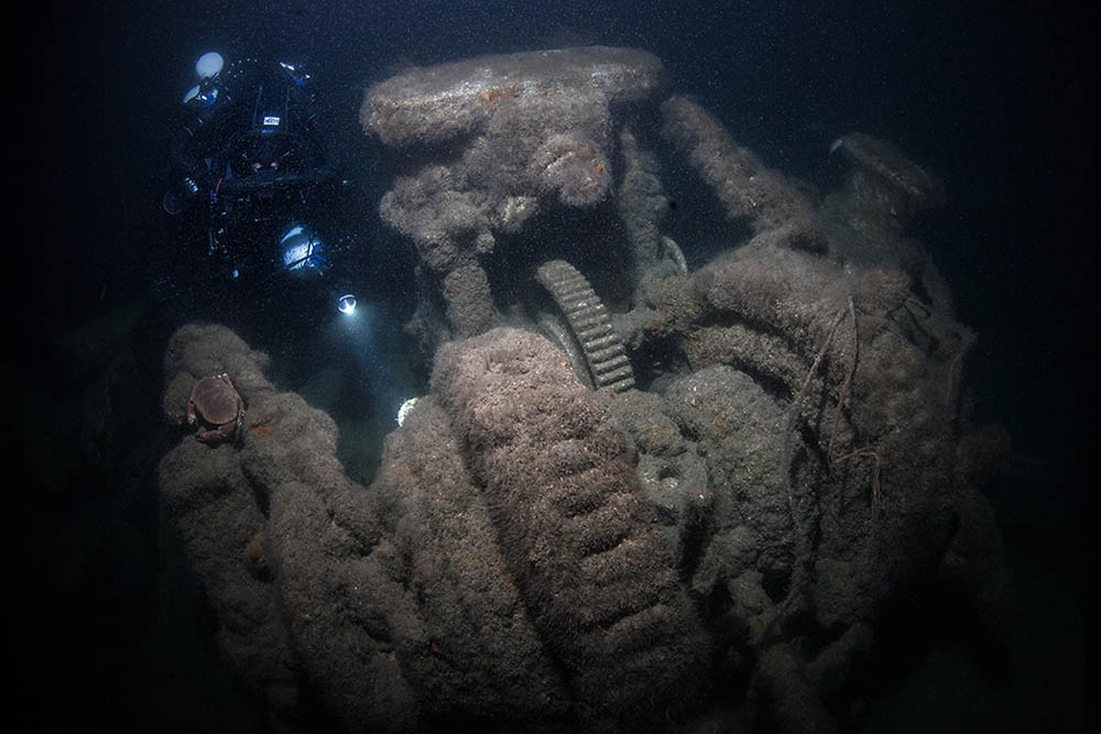 Bow windlass and anchor chains upright on the wreck.