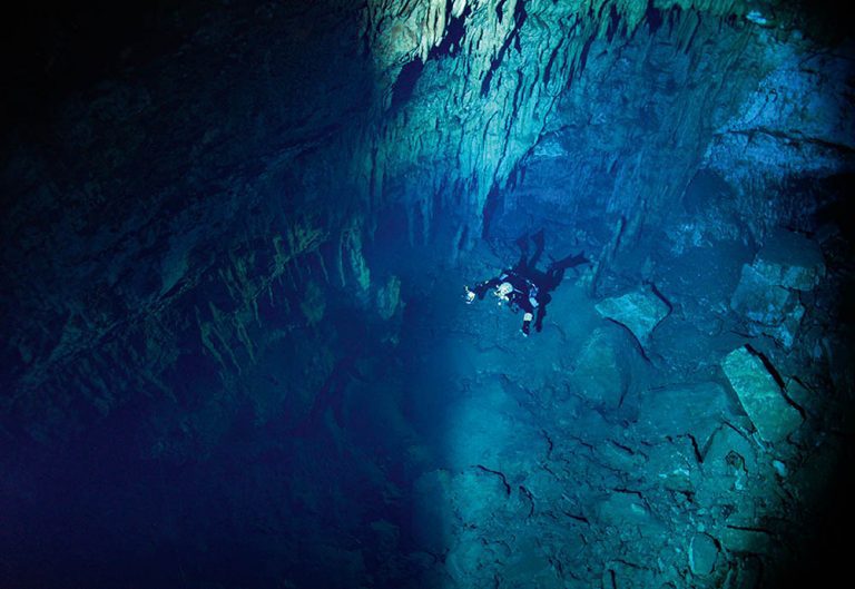Diving in Karavomilos Lake cave.