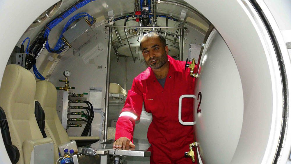Yaqub Al-Omoud prepares to enter the saturation chamber, which allows diving for longer periods and greater efficiency in operations. It will be his home for six to eight weeks.