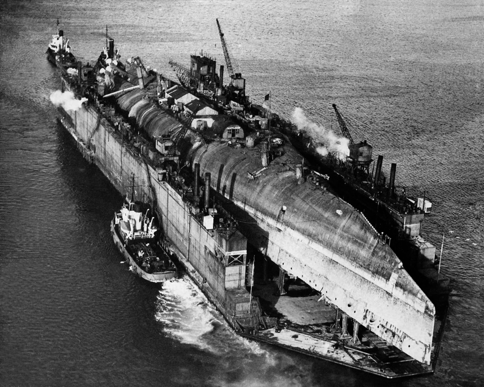 The battlecruiser Derfflinger on floating dry dock en route for breaking.