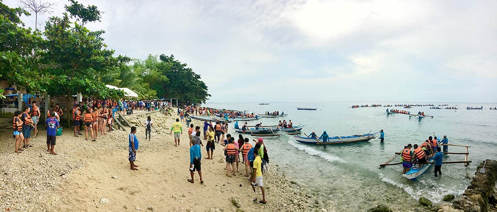 Visitors gather for the whale shark experience. Numbers were recently limited – to 800 a day.