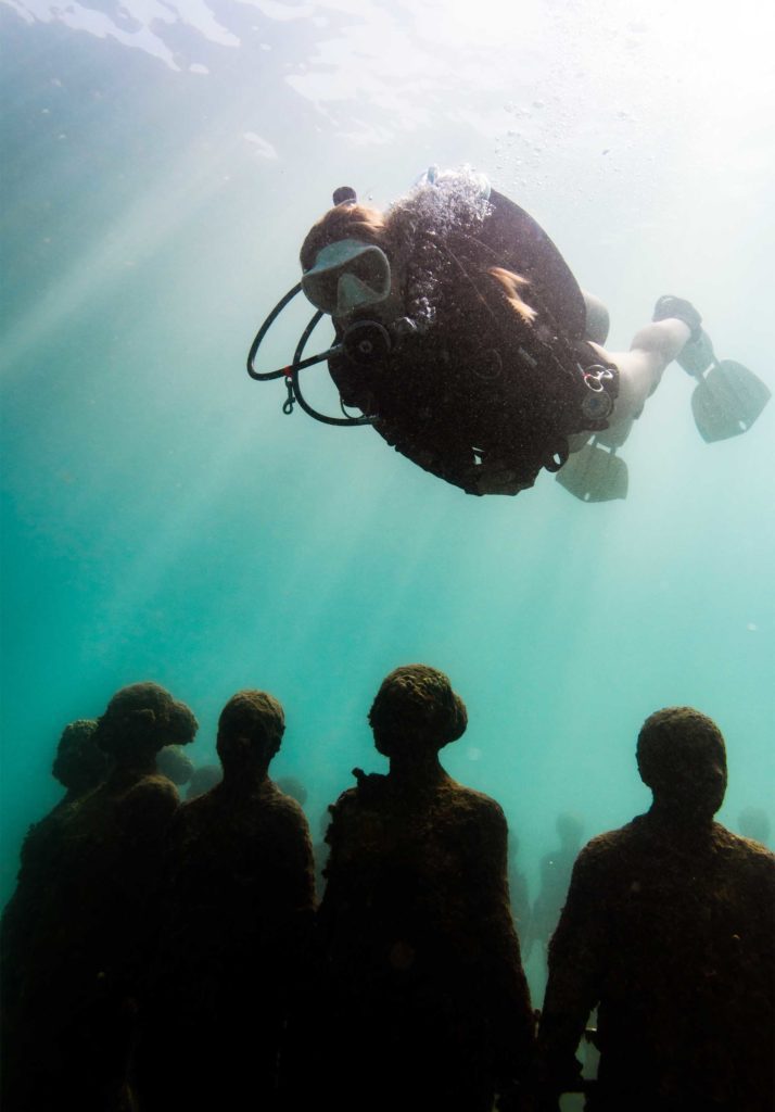 diver and underwater sculptures in Grenada