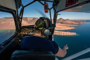 pilot of spotter plane scans the ocean