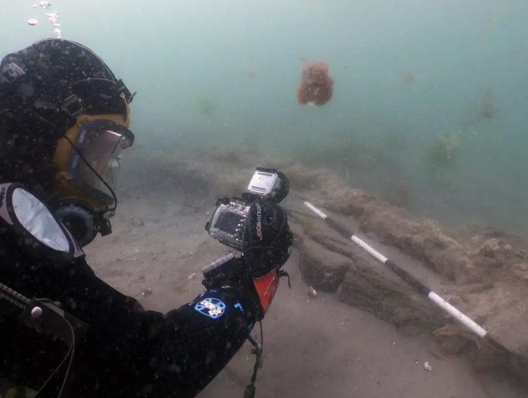 diver photographing the Invincible rudder