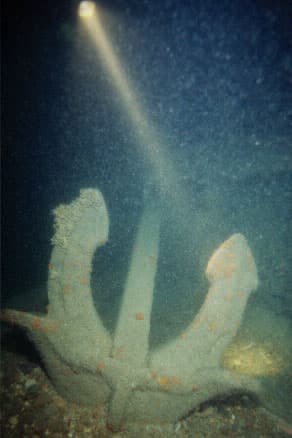 An anchor behind the bow may have belonged to another ship and been fouled and lost on the wreck.