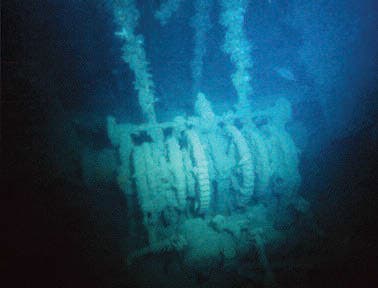The anchor winch at the bow has fallen through the deck, but the anchor chains are still attached on The Saracen