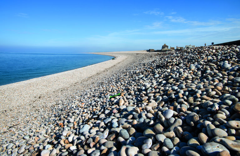 Visit-Dorset - A fantastic shot over Chesil Beach and the Fleet Nature  Reserve. 💦⁠ Chesil beach is a bank of pebbles stretching for 18 miles  along the Dorset Coast. Trapped behind this