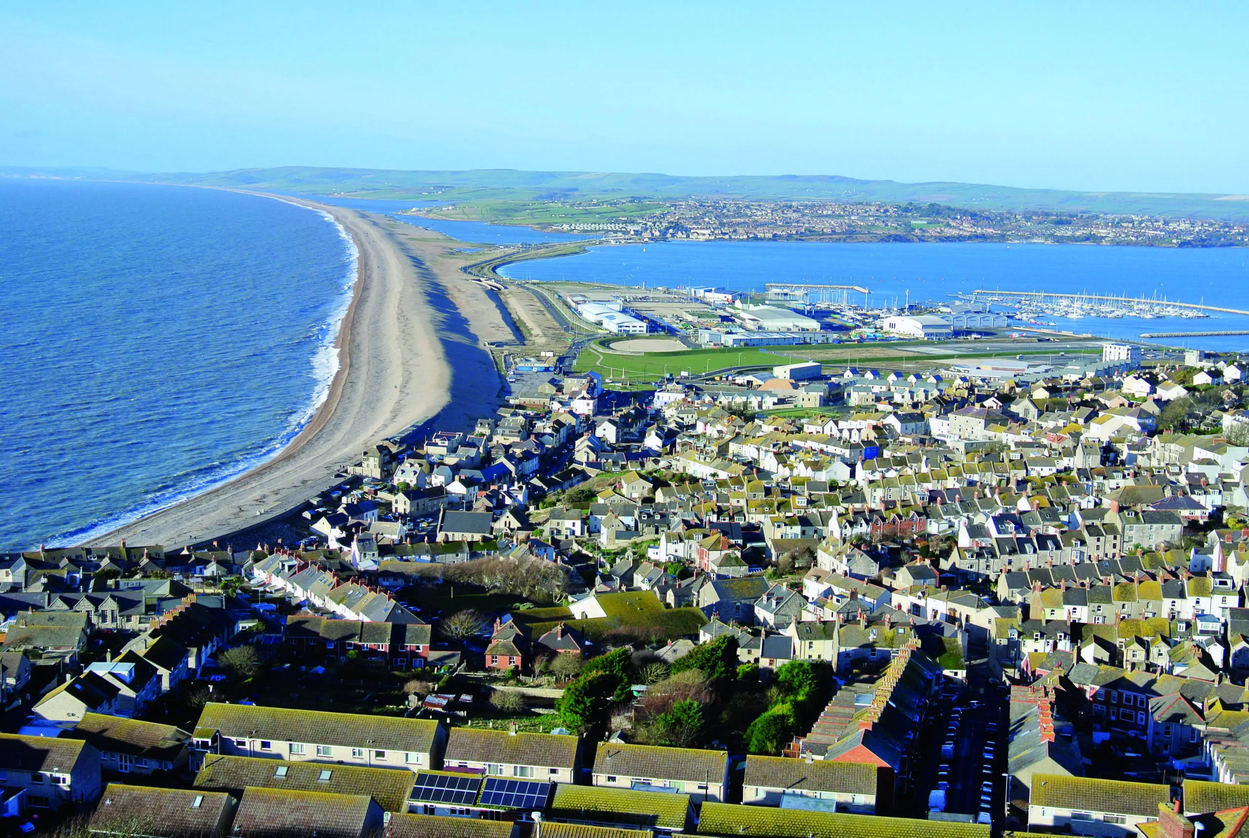 Visit-Dorset - A fantastic shot over Chesil Beach and the Fleet Nature  Reserve. 💦⁠ Chesil beach is a bank of pebbles stretching for 18 miles  along the Dorset Coast. Trapped behind this