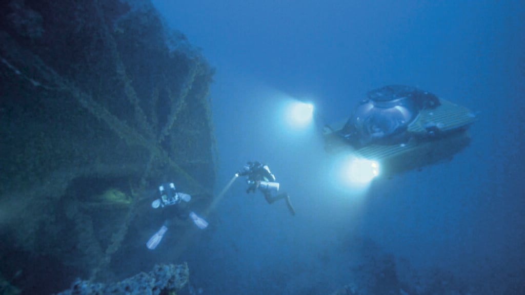 Extreme Underwater Filming: Lighting Challenges in Caves, Mines, and Deep Wrecks 1 Extreme underwater filming of the Britannic wreck showing diver positions, submersibles and lighting setup