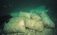 Sacks of scallops tipped onto the seabed