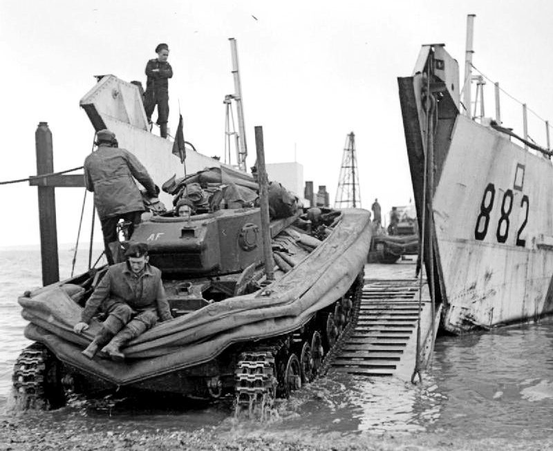 A DD Valentine tank being loaded onto a landing craft in January 1944 (Imperial war Museum)