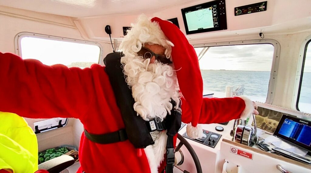 Santa at the helm (Jurassic Aqua Sports)