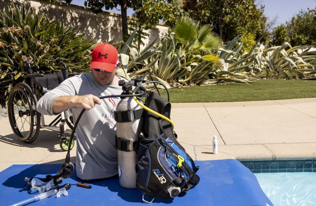 Bryan Anderson prepares for a dive (PADI)