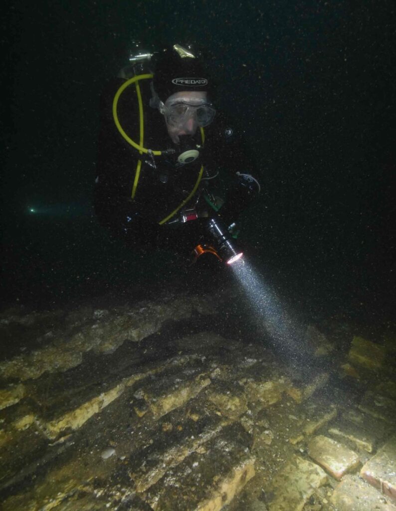 NAS diver examines the brick galley floor (Martin Davies)