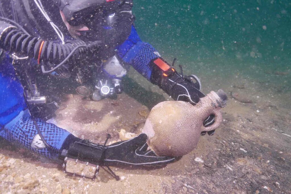 Diver holding Bellarmine jug (James Clark)