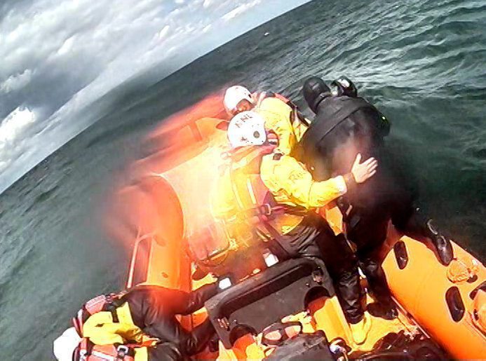 A diver is pulled onto the Atlantic 85 (RNLI Redcar)