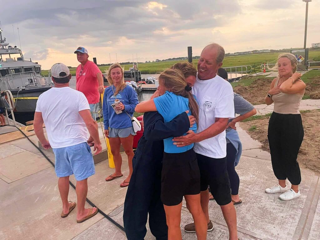 Dan and Evan Williams are reunited with their family (USCG)