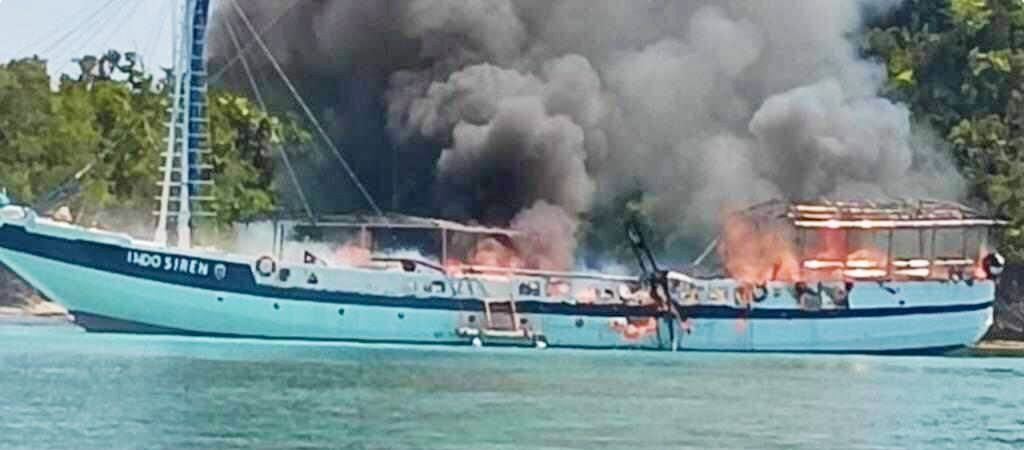 The liveaboard at an earlier stage of the blaze