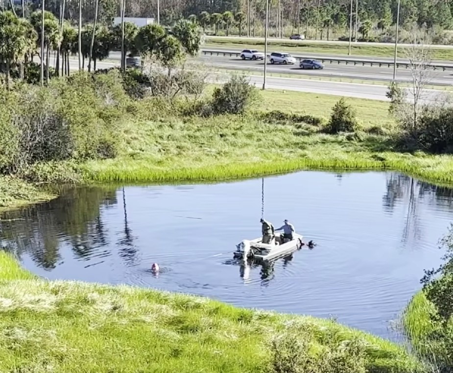 Divers searching the pond (Sunshine State Sonar)
