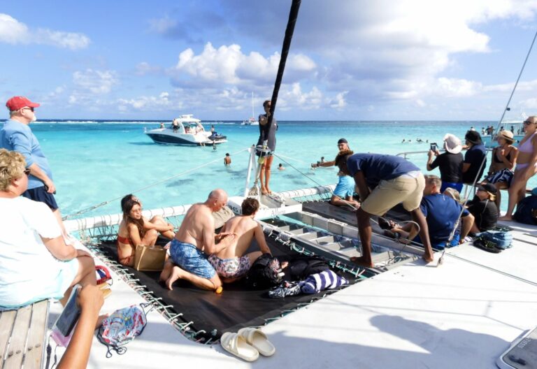 Thousands of visitors swim at the sandbar to take part in the Stingray City experience, smearing on sun-tan oil before jumping in. Most commercial sunscreens are toxic to corals
