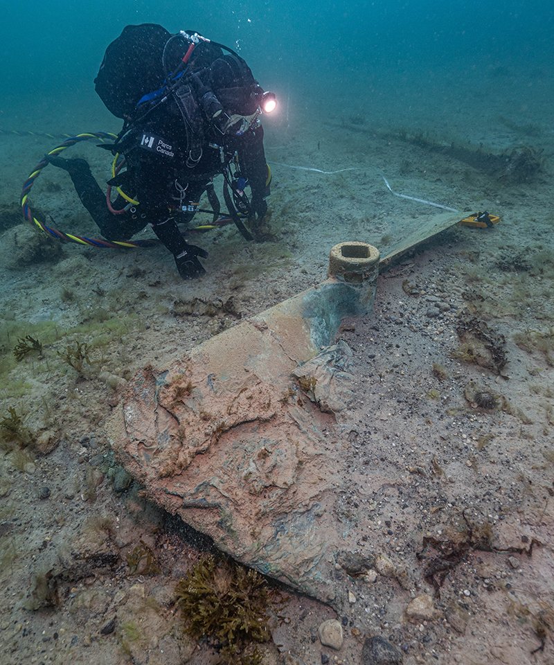 Parks Canada underwater archaeology technician Joe Boucher documents one of HMS Erebus’s propellers in the debris field (Brett Seymour / Parks Canada)