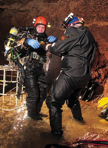 Diving Everest in Pozo Azul 5 Team-leader Jason Mallinson gets kitted up, aided by Brian Scofield.
