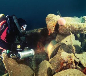 Mark Bullen photographed at the moment he discovered the main mast bell