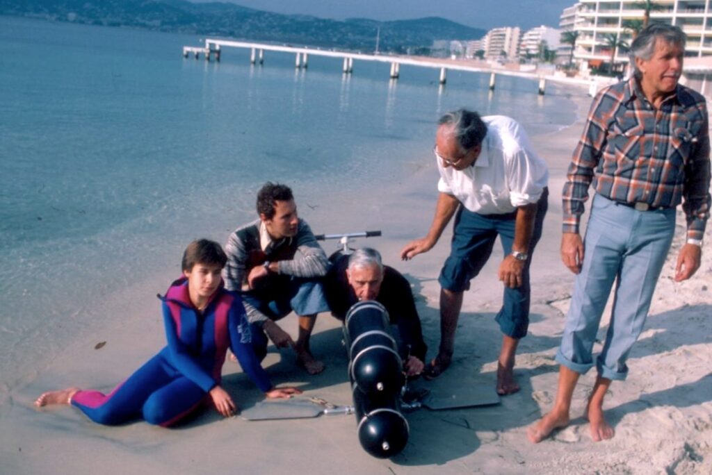 On the beach at Juan les Pins, with Tailliez behind Pegasus, Rebikoff and freediver Jacques Mayol (© John Christopher Fine)