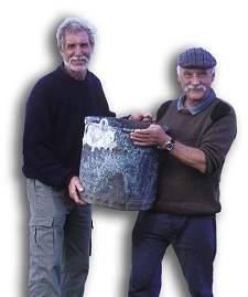 John Dadd (left), who discovered the wreck in 1979, hands a bronze cauldron to Colin Martin, to be deposited in the National Museum of Scotland