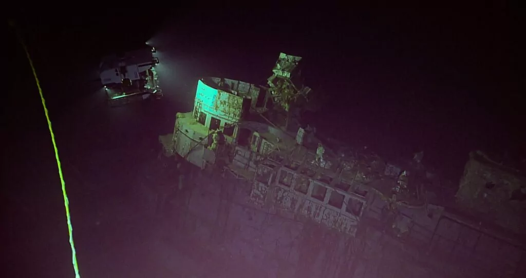 5km-deep dive reveals aircraft, map + mystery car