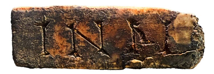 Ivory plaque inscribed with the letters 'INRI' (Jesus of Nazareth, King of the Jews) (CHSP)