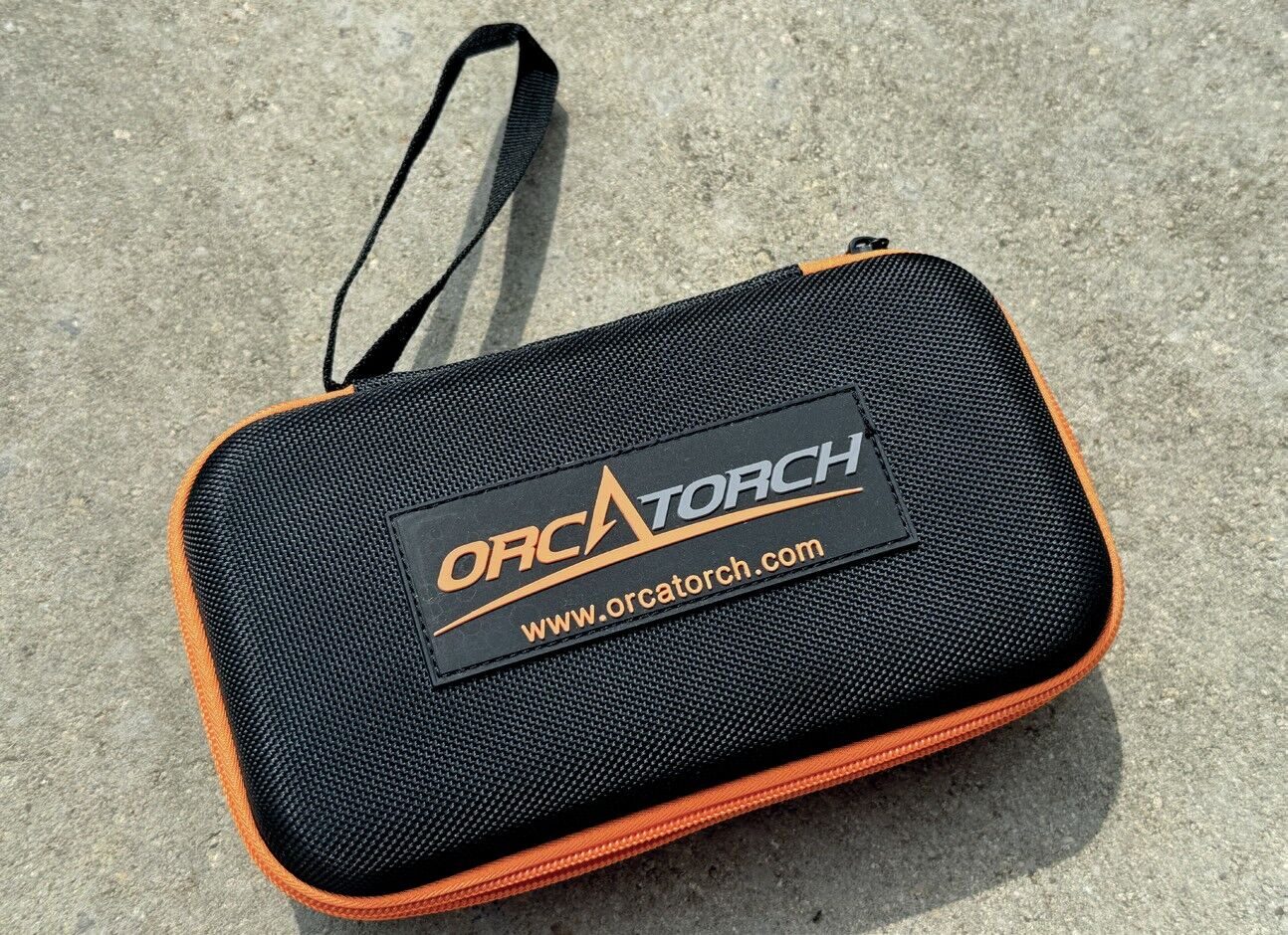 OrcaTorch ZD710 MK2 Dive Torch Review: Adjustable Beam and 1500-Lumen USB-C Rechargeable Light 5 OrcaTorch ZD710 MK2 dive torch soft carry case containing battery, cable, and accessories.