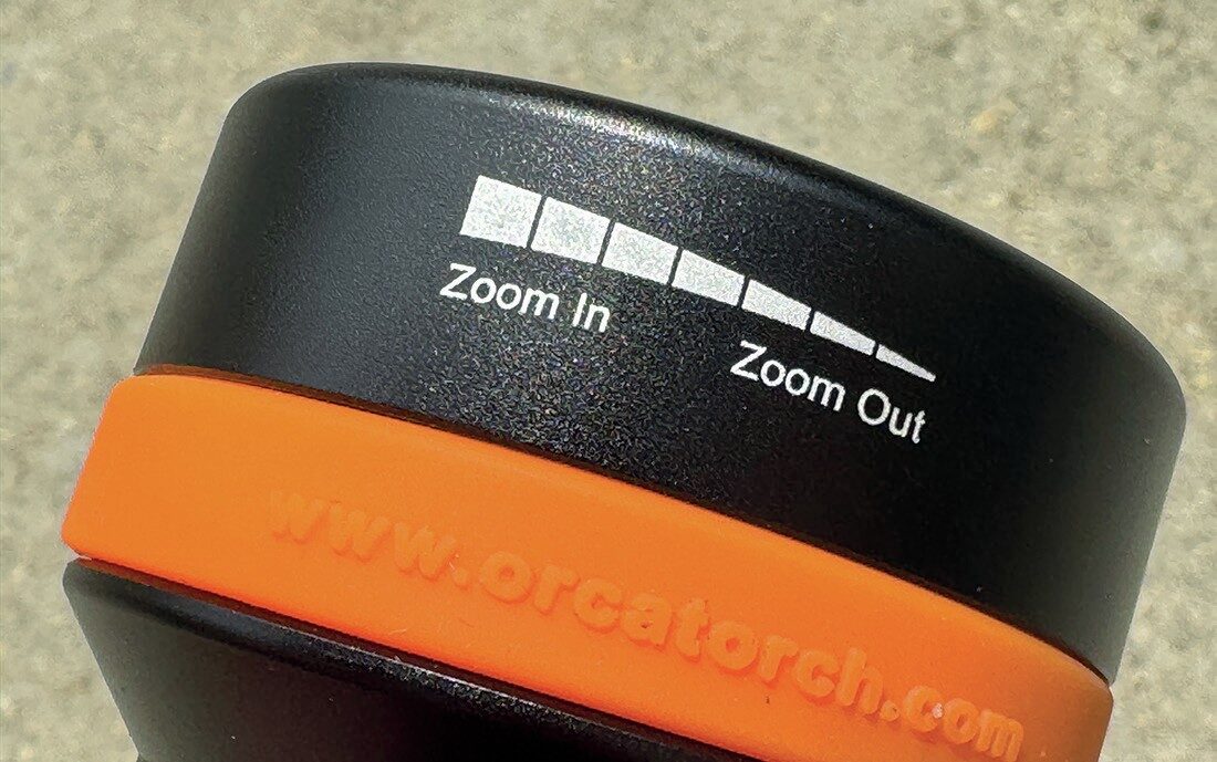 OrcaTorch ZD710 MK2 Dive Torch Review: Adjustable Beam and 1500-Lumen USB-C Rechargeable Light 3 OrcaTorch ZD710 MK2 dive light head close-up illustrating adjustable beam mechanism for spot or flood lighting.