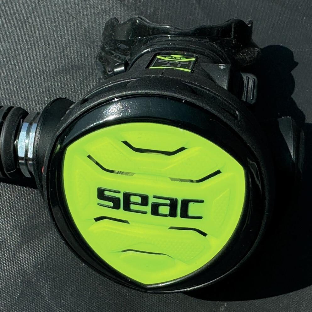 Close-up of Seac IT 500 Ice regulator second stage with Seac logo and adjustable controls.