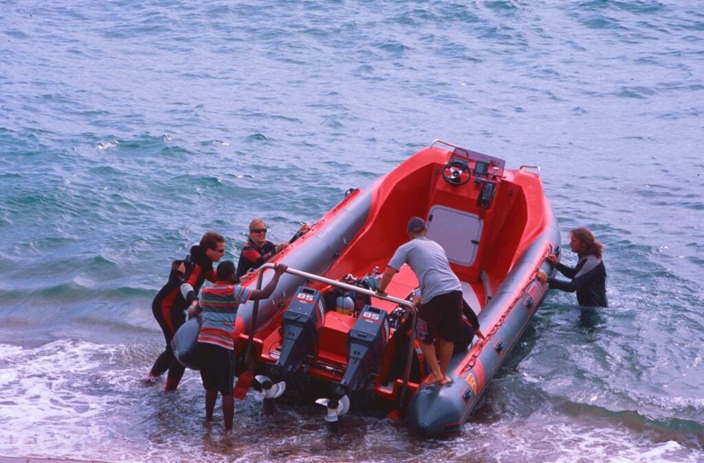 Divers push the rubber duck out