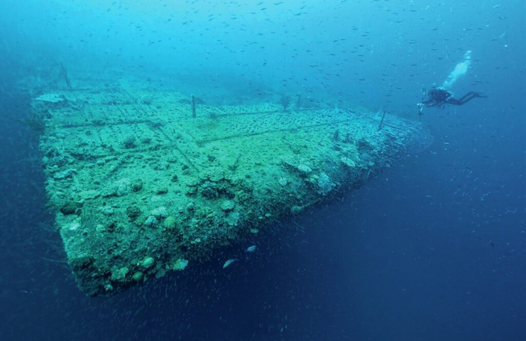 Diving the Wrecks of Bikini Atoll: Exploring the Nuclear Fleet Beneath the Pacific 2 Technical diver approaching the USS Saratoga wreck at Bikini Atoll