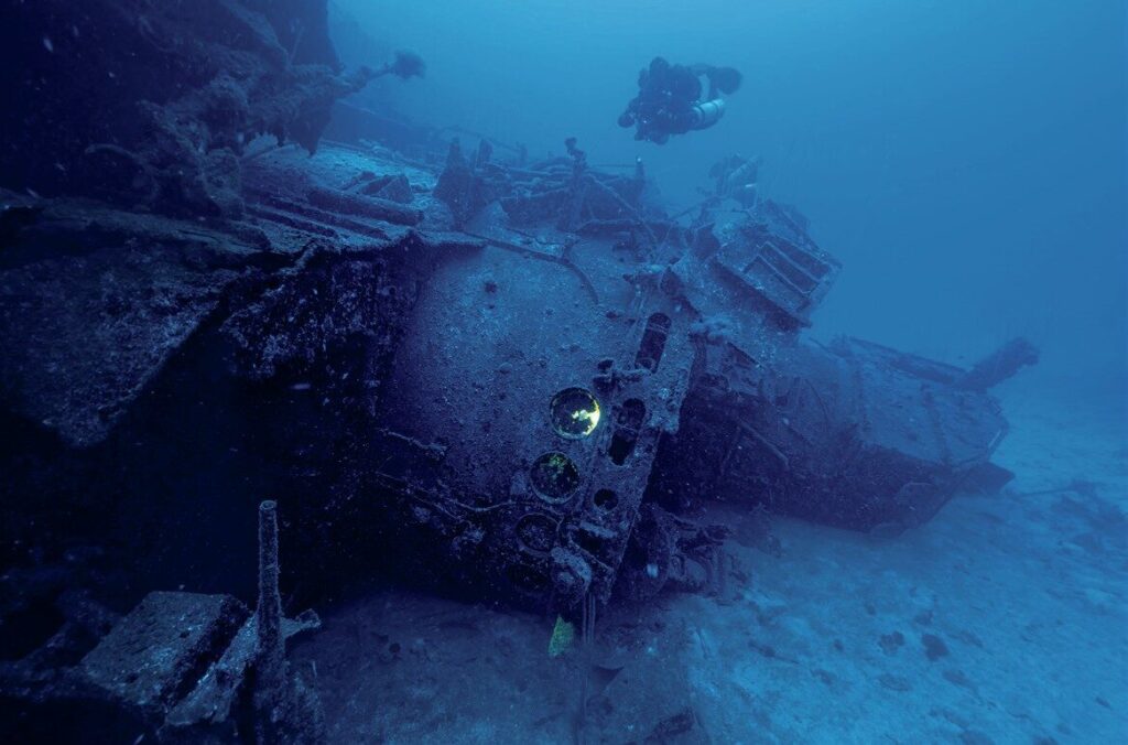 Diving the Wrecks of Bikini Atoll: Exploring the Nuclear Fleet Beneath the Pacific 5 Diver exploring the wreck of the USS Anderson
