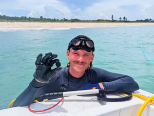 Just Right first mate Luke with one of the silver coins (Queens Jewels)
