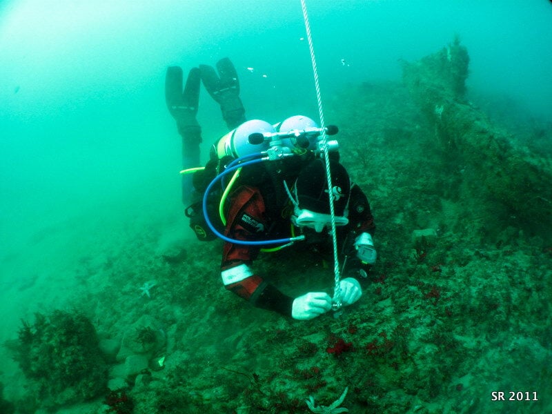 Shipwrecks that will change diving lives in 2026 5 Diver attaches a dive-trail buoy (Coronation Wreck Project)