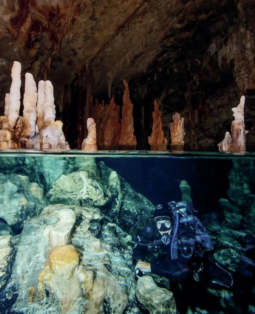 Cave dive at Elephant Cave in Crete with stalactites and submerged tunnel