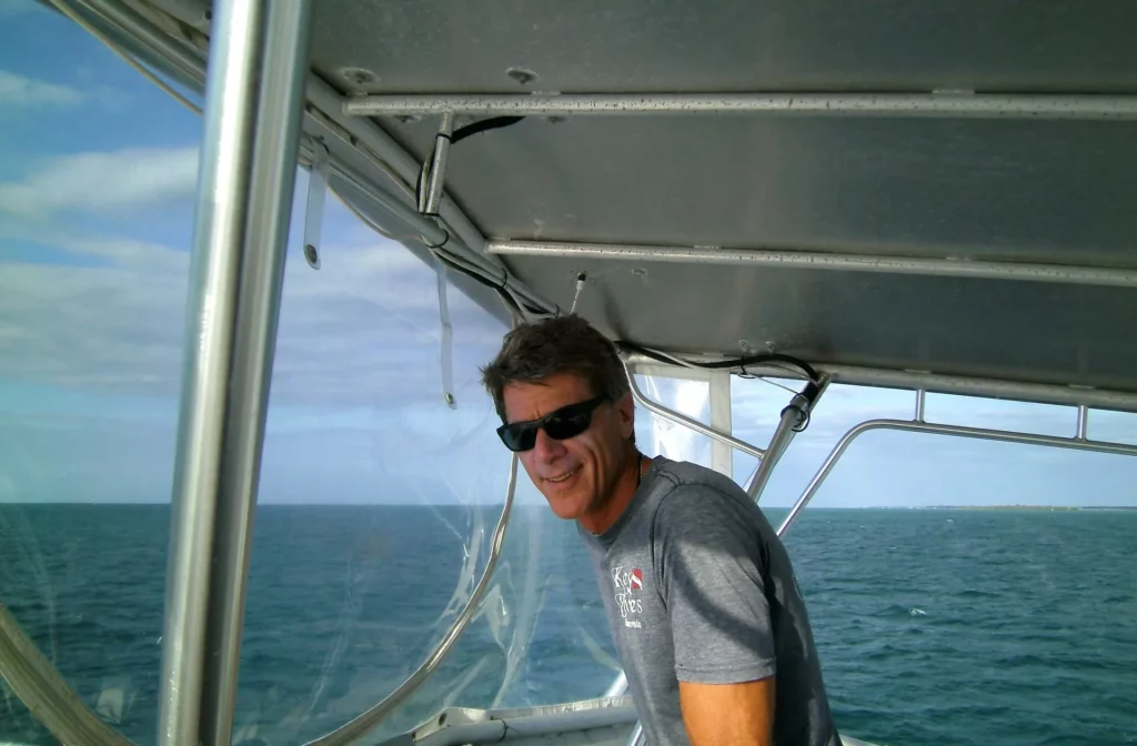 Captain Mike Goldberg at the helm of Giant Stride (John Christopher Fine 2026)