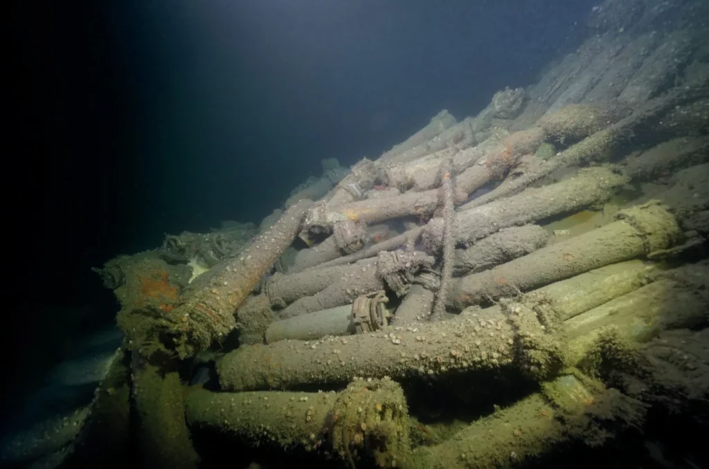 The deck of the hull of the U58 littered with ammunition and aluminium tubes with copper caps for the grenades