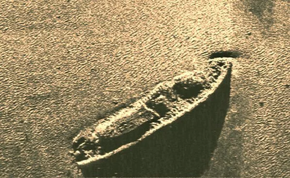 Mid-90s sonar image showing the wreck of USS Monitor resting upright on the seafloor, with the ship’s deck and circular turret clearly visible, NOAA