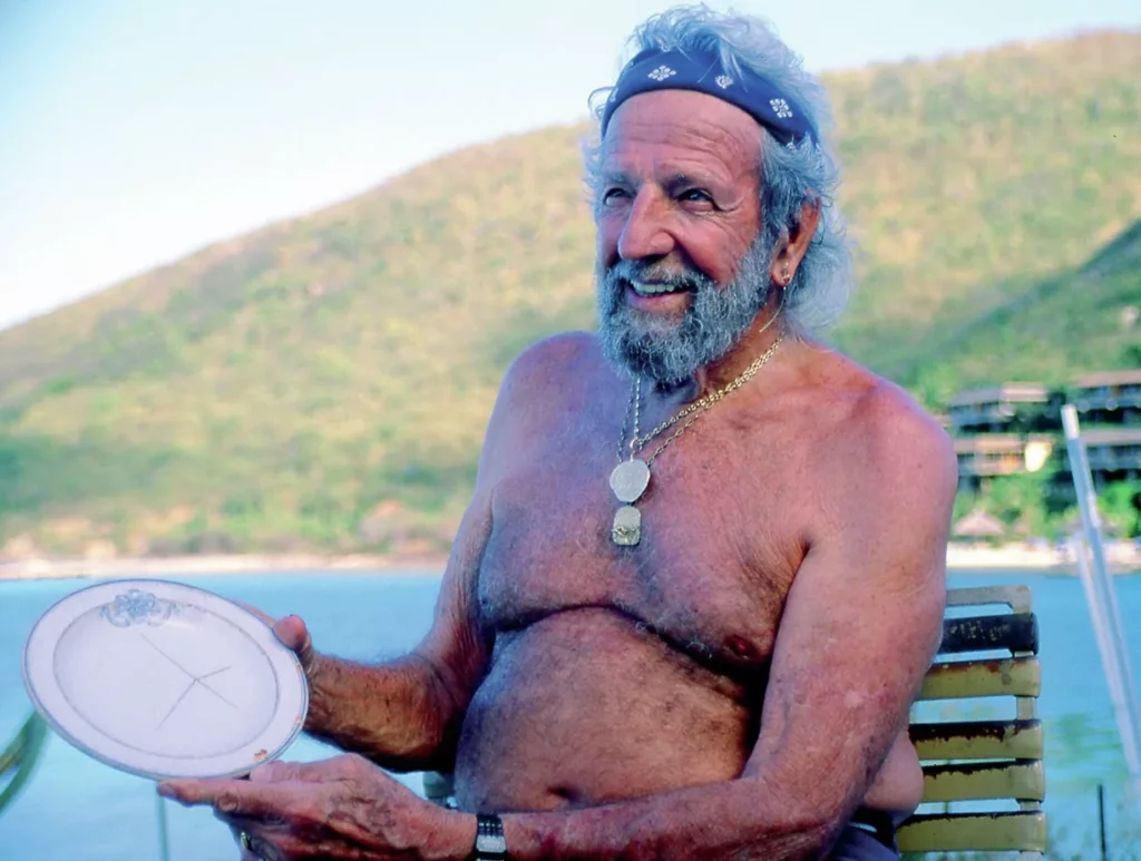 Diving legend Bert Kilbride displaying a salvaged ceramic plate from the RMS Rhone.