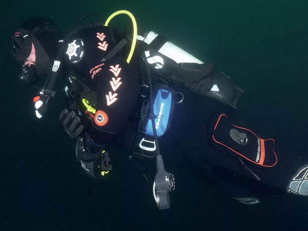 A drysuit diver test diving the Scubapro Hydros Pro 2 back-inflate BCD.