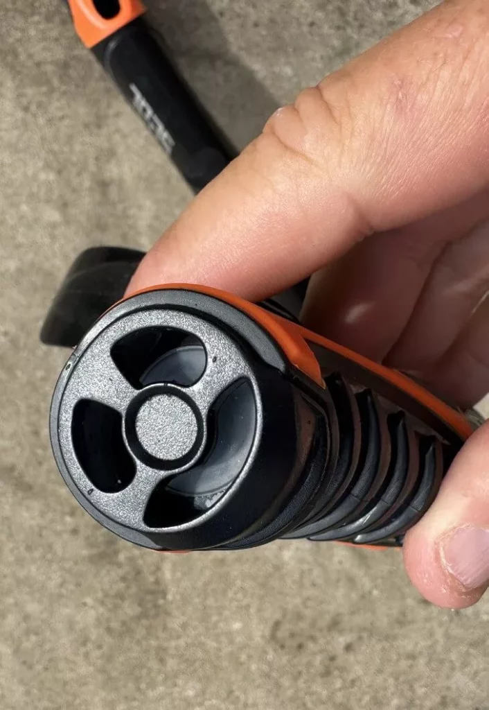 Close-up of the one-way purge valve located below the mouthpiece for easy water clearing.