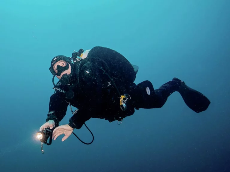 Jill Heinerth, world-renowned cave diver and explorer, in full technical scuba diving gear, illustrating perfectly how managing fear underwater fear can be achieved.