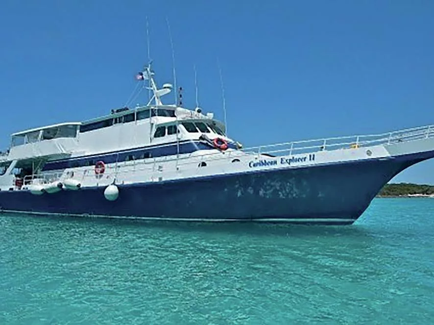 Q&A with Liveaboard Pioneer Clay McCardell 7 The Caribbean Explorer II liveaboard ship anchored in turquoise tropical waters.