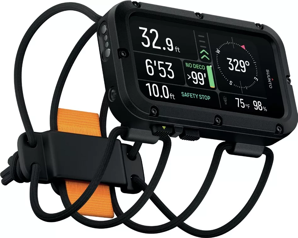 A Suunto Nautic dive computer with a bungee cord mount displaying the main dive screen.